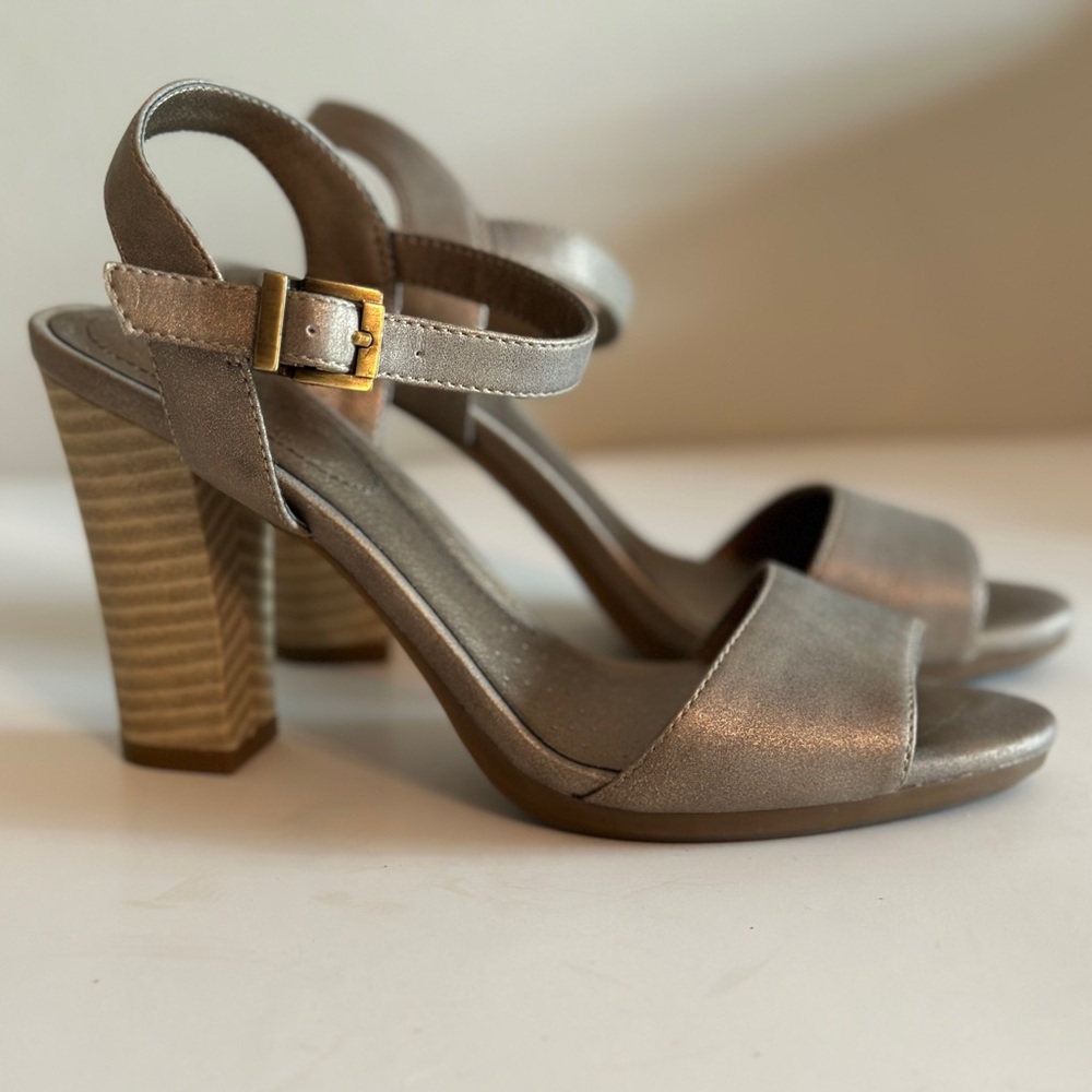 High heel, olive green metallic sandals. Antique brass buckle.